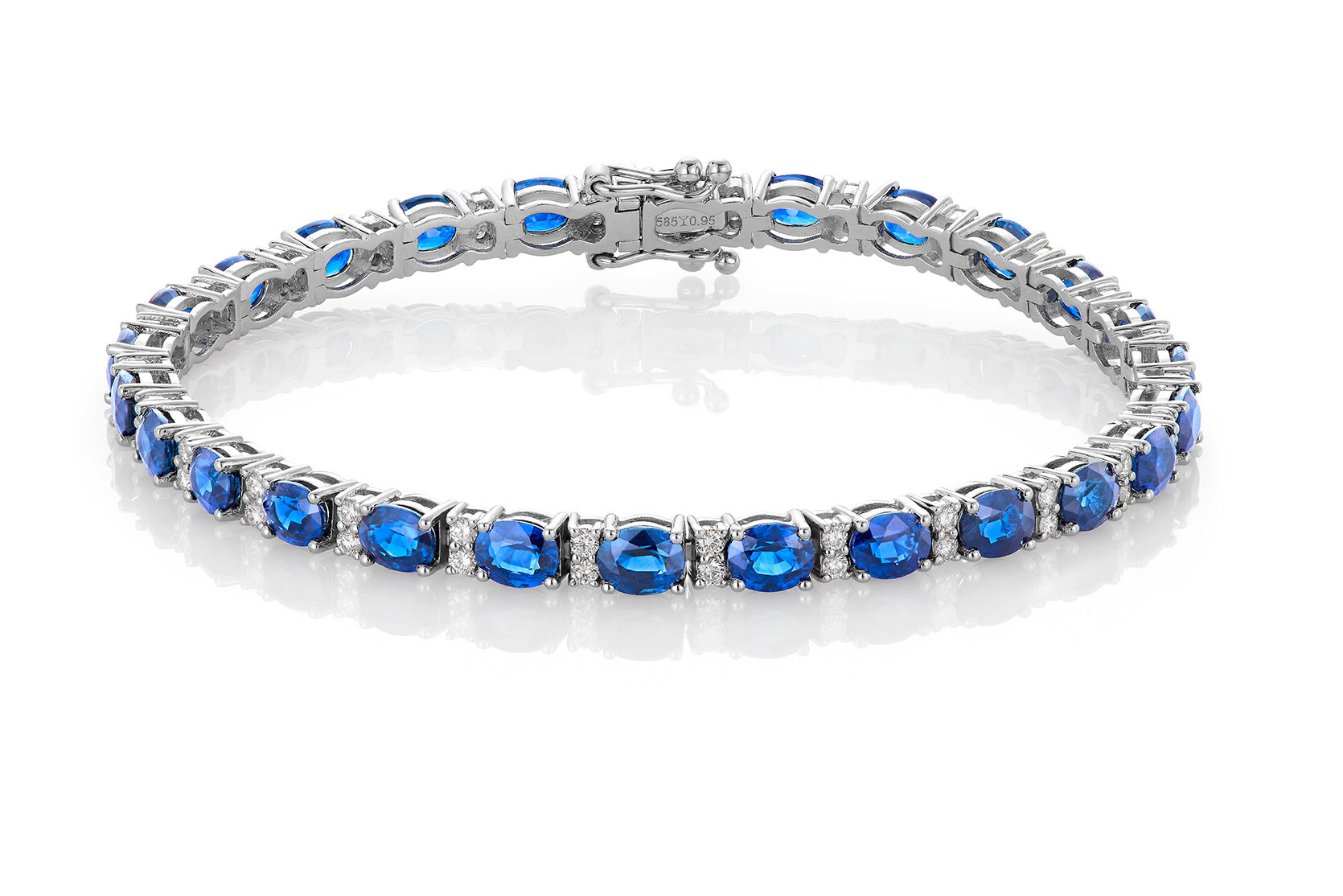 Haakonsen armbånd i hvitt gull med safirer og diamanter 0.95 ct.